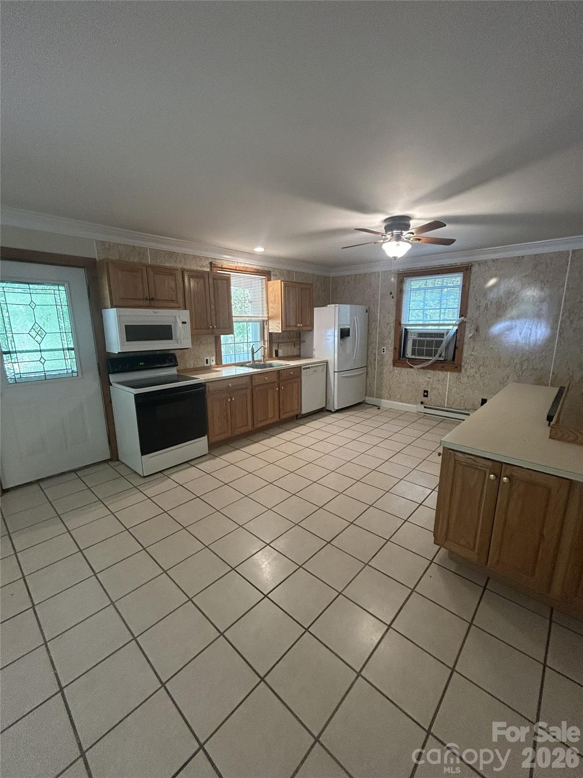 2051 Sutton Spring Road York, SC 29745 - Photo 20 of 47 a large kitchen with a stove a sink dishwasher and a refrigerator