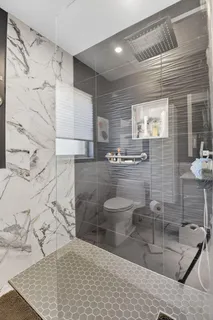 a view of a tree in front of a house