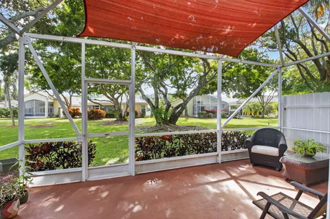a front view of multiple houses with street