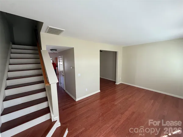 a view of entryway with wooden floor