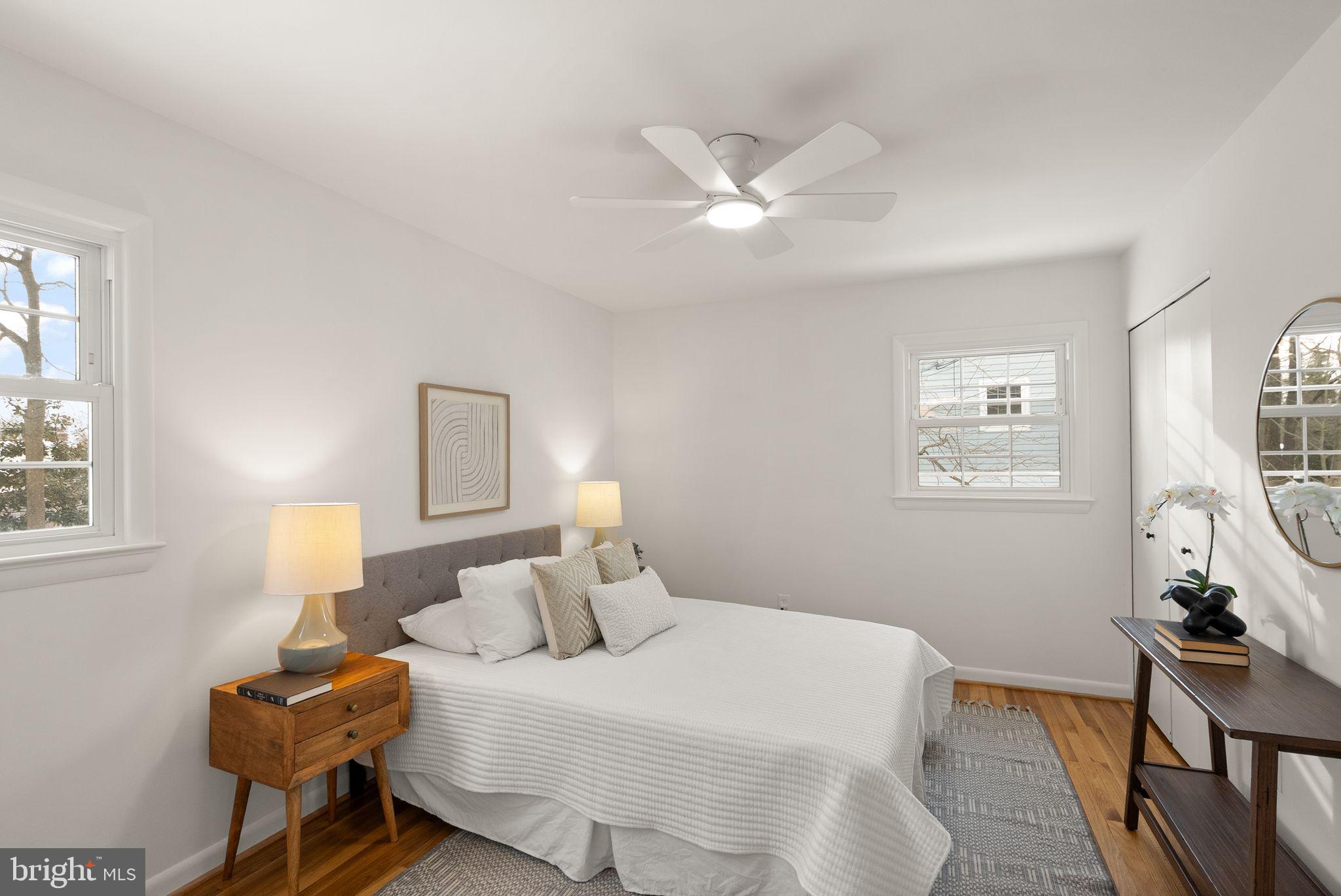 4217 Alcott Street Alexandria, VA 22309 - Photo 19 of 42 a bedroom with a bed and wooden floor