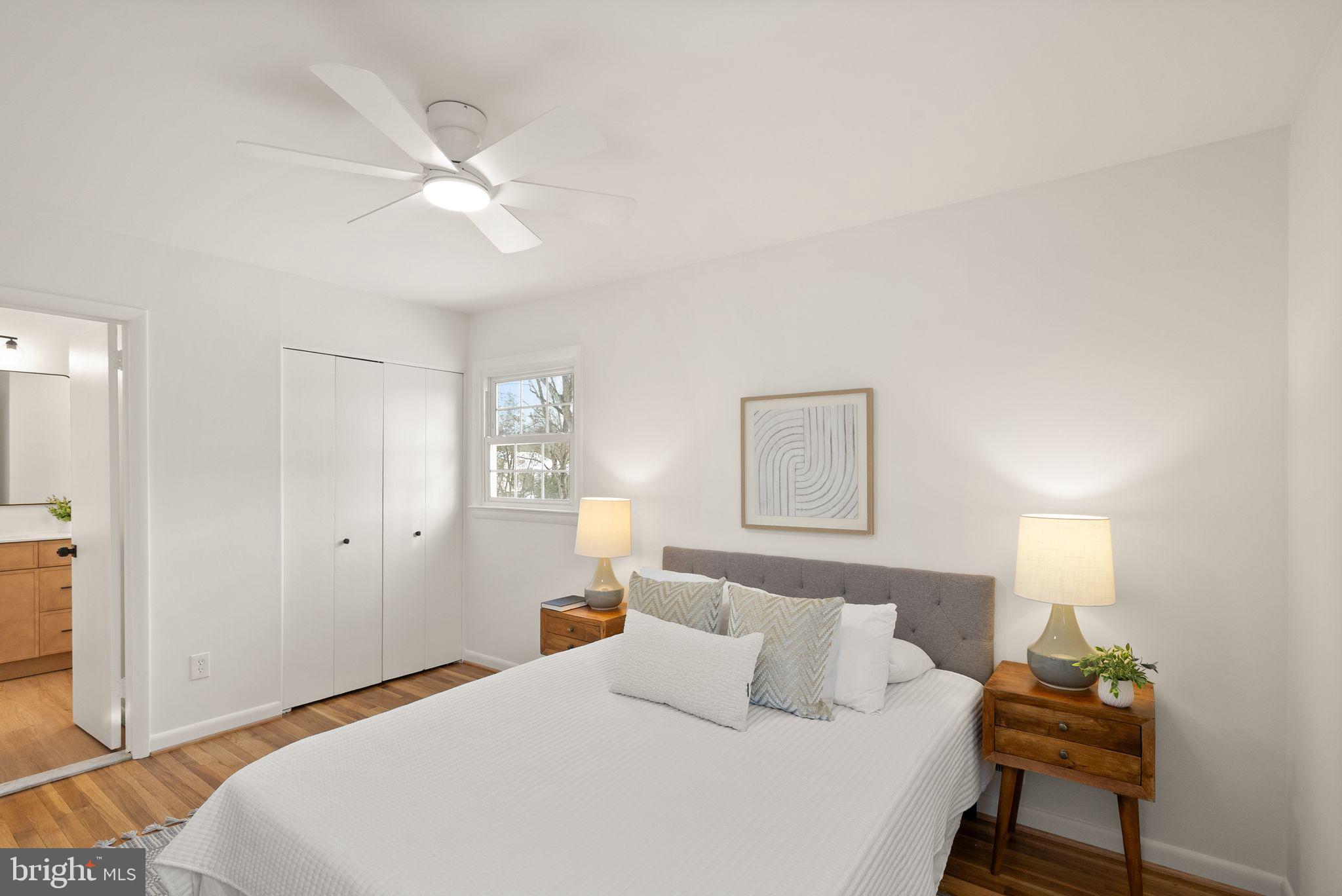 4217 Alcott Street Alexandria, VA 22309 - Photo 21 of 42 a bedroom with a bed and a lamp