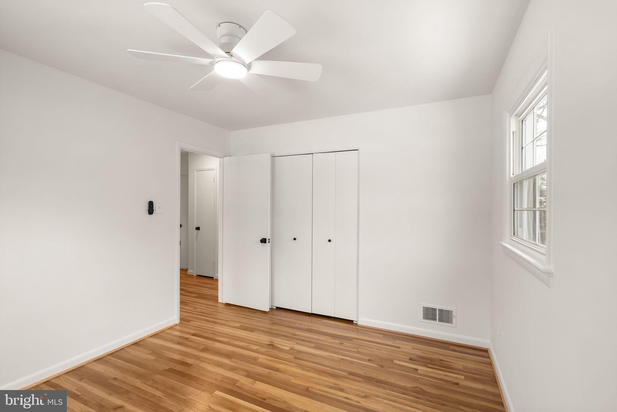 4217 Alcott Street Alexandria, VA 22309 - Photo 24 of 42 a view of an empty room with window and wooden floor