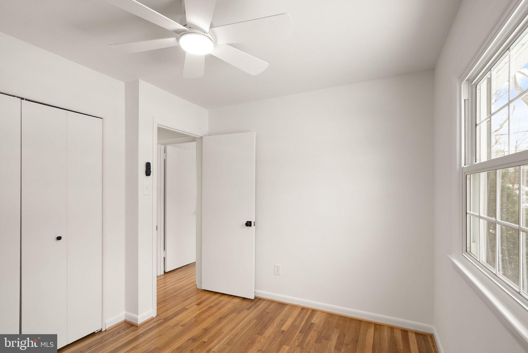 4217 Alcott Street Alexandria, VA 22309 - Photo 26 of 42 wooden floor in an empty room with a window