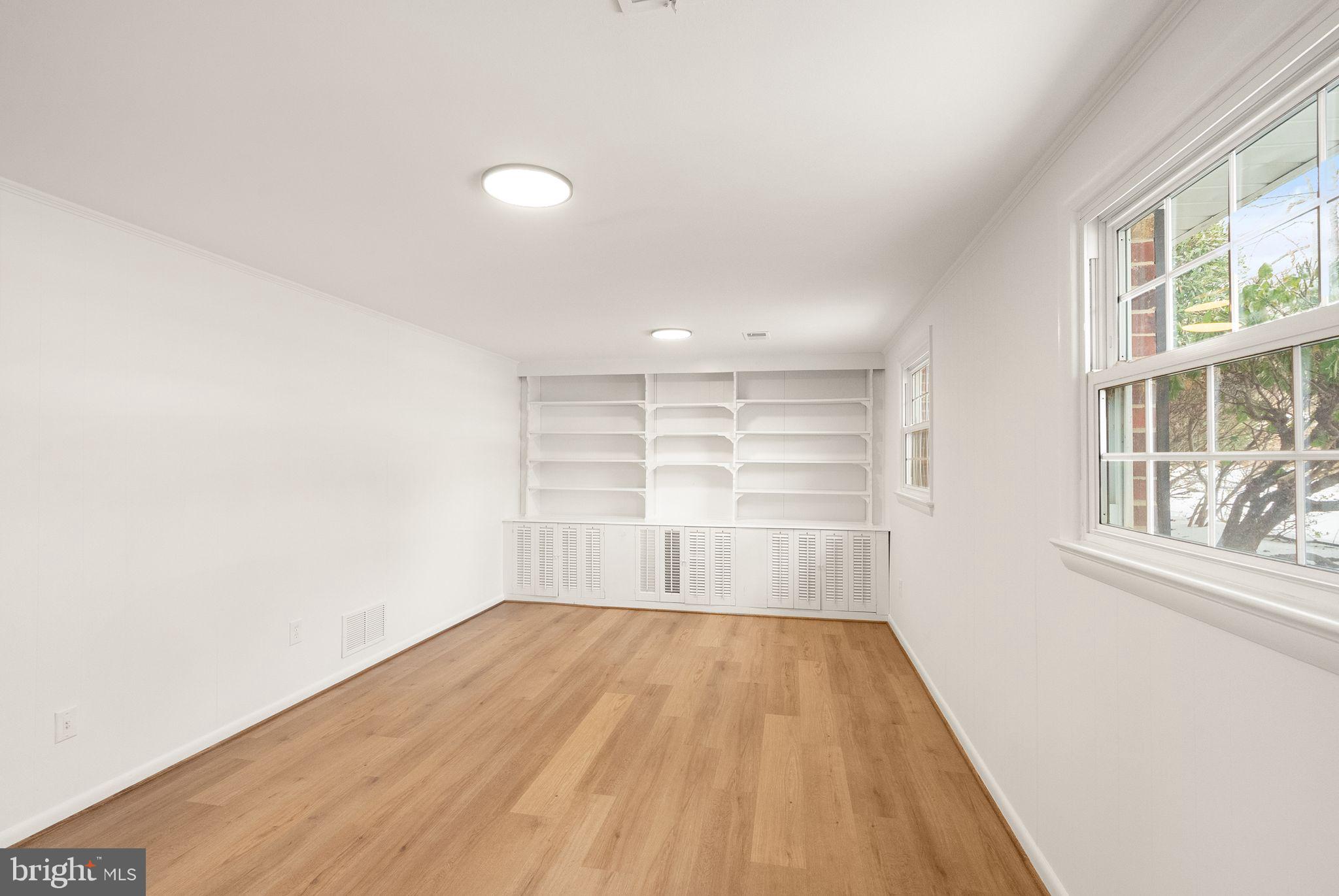 4217 Alcott Street Alexandria, VA 22309 - Photo 28 of 42 wooden floor in an empty room with a window
