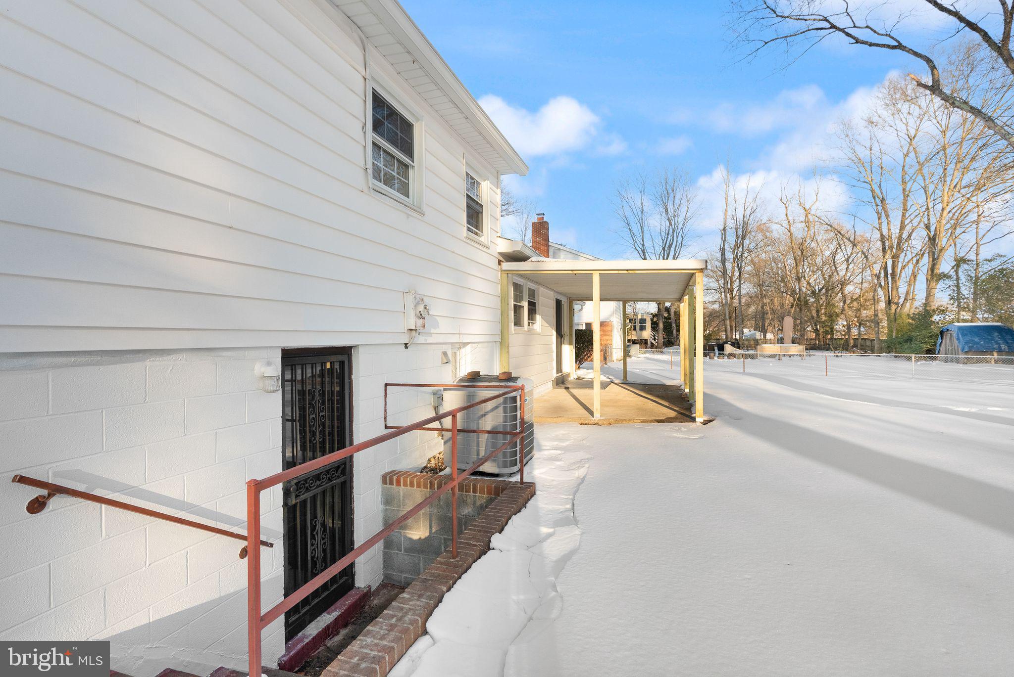 4217 Alcott Street Alexandria, VA 22309 - Photo 35 of 42 a view of a patio with a table and chairs