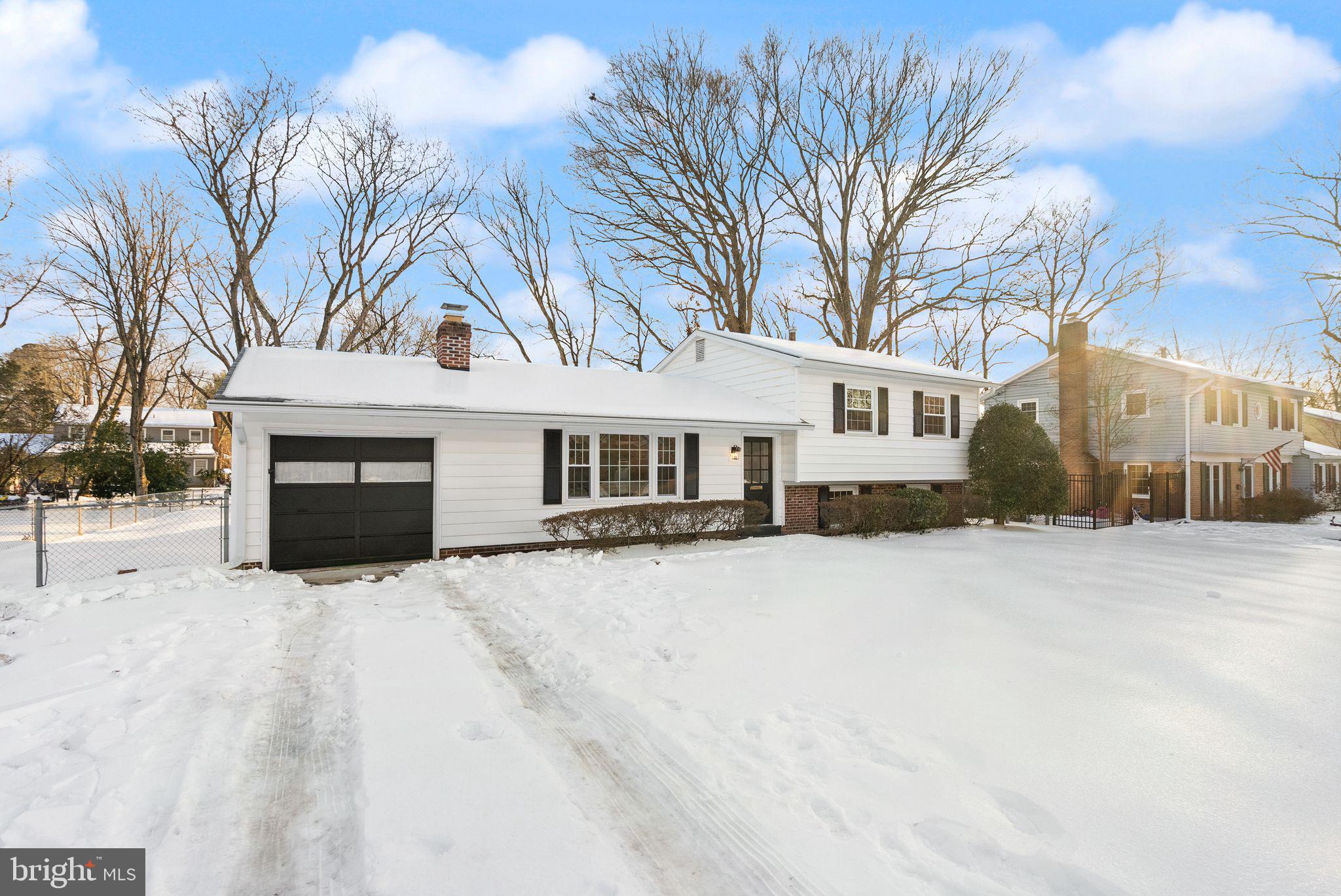 4217 Alcott Street Alexandria, VA 22309 - Photo 39 of 42 a front view of a house with yard covered in snow