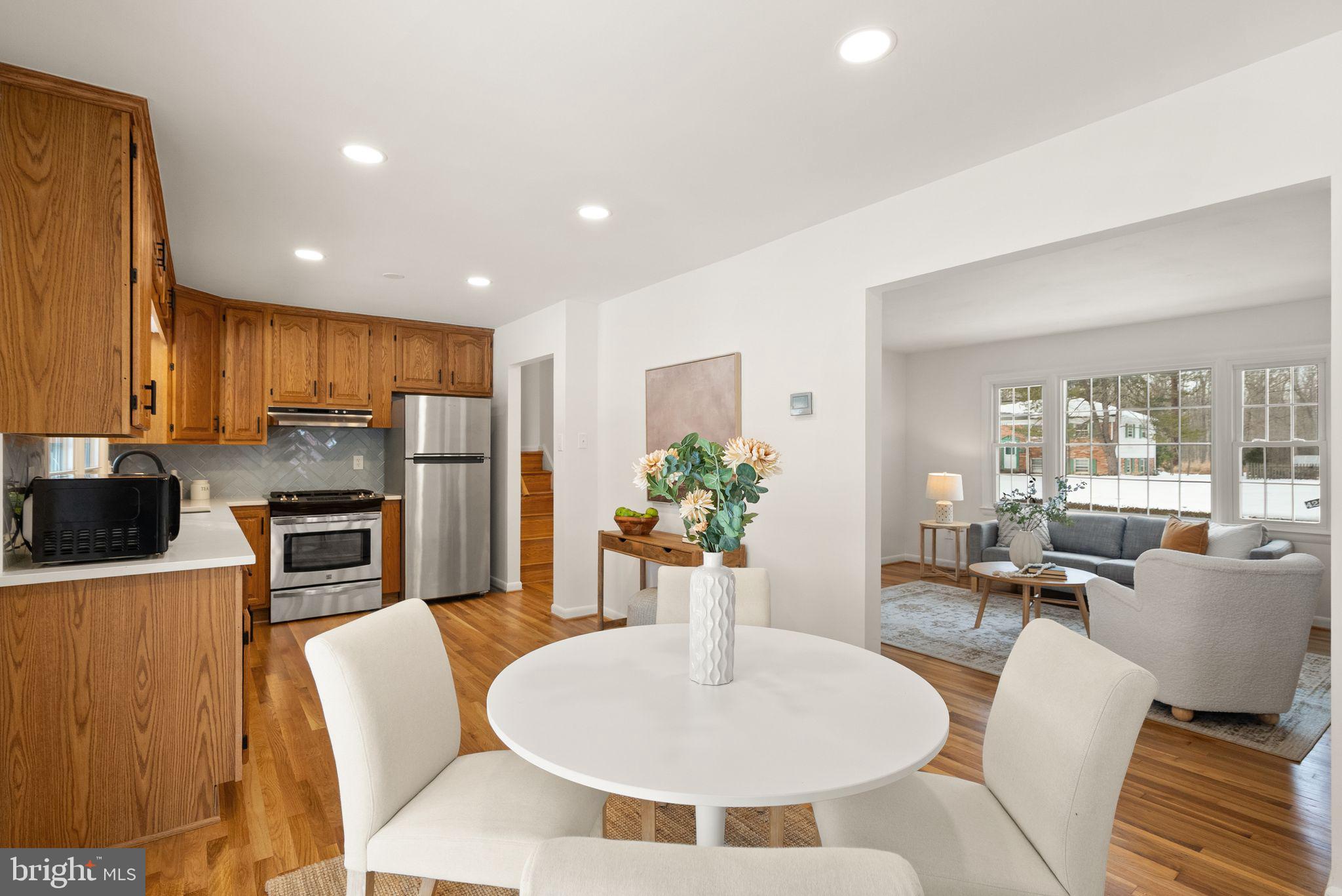 4217 Alcott Street Alexandria, VA 22309 - Photo 10 of 42 a living room with fireplace furniture and a dining table