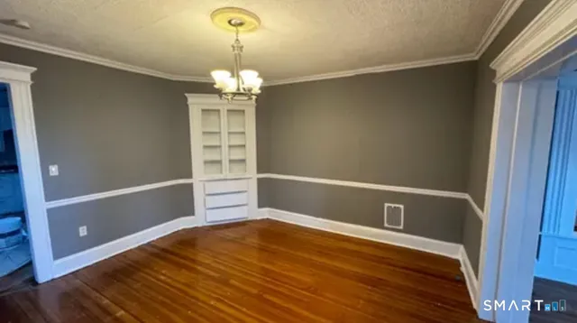 a view of a livingroom with wooden floor