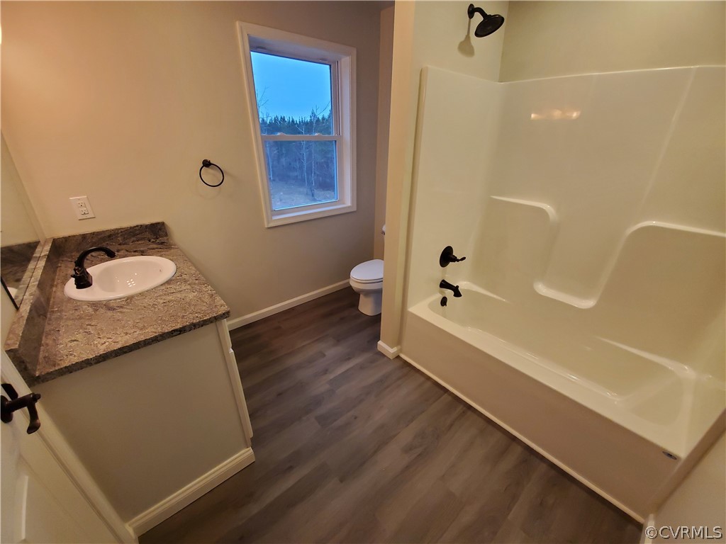 488 Guinea Road Farmville, VA 23901 - Photo 16 of 22 a bathroom with a granite countertop sink a toilet and shower
