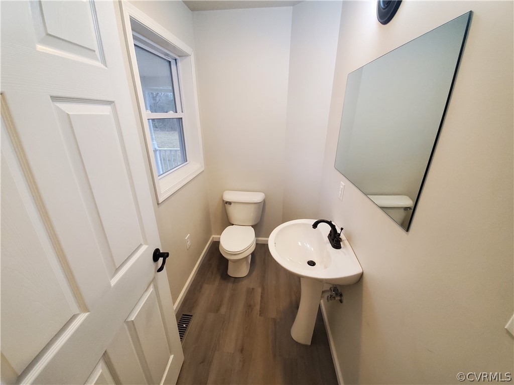 488 Guinea Road Farmville, VA 23901 - Photo 3 of 22 a bathroom with a sink a toilet and a mirror