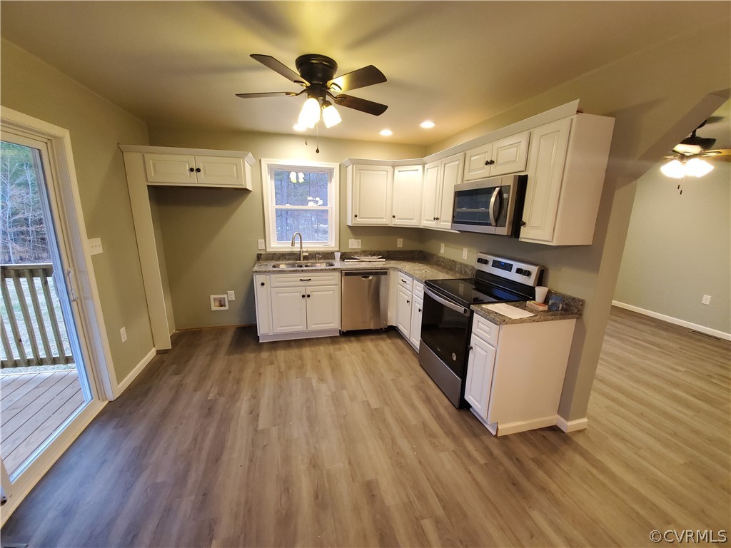 488 Guinea Road Farmville, VA 23901 - Photo 5 of 22 a kitchen with stove a sink and a refrigerator