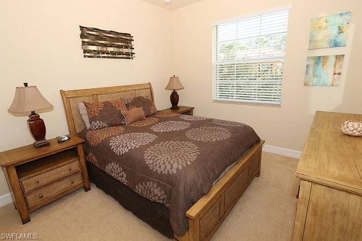 6525 Monterey Point, Unit 203 Naples, FL 34105 - Photo 13 of 25 View of carpeted bedroom