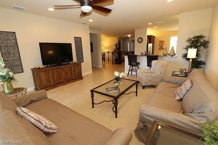 6525 Monterey Point, Unit 203 Naples, FL 34105 - Photo 5 of 25 Tiled living room with ceiling fan