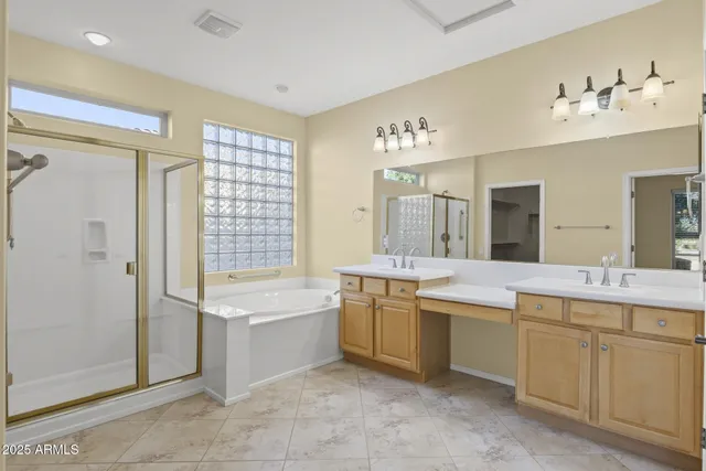 a bedroom with a bed and glass window