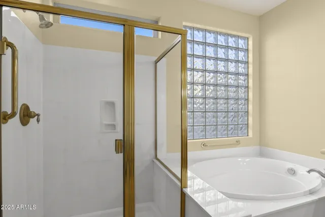 a large white kitchen with a sink and dishwasher with a large kitchen island
