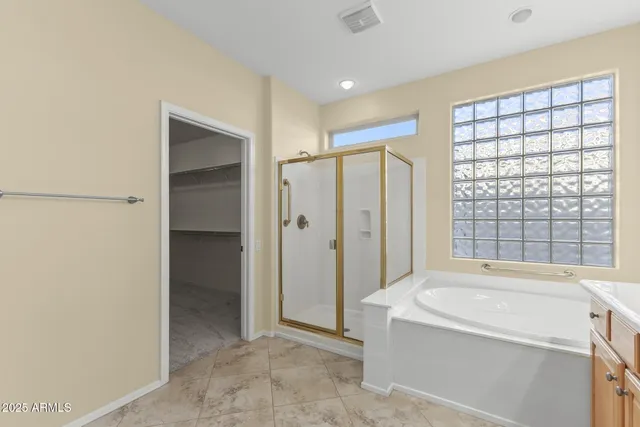 a bathroom with a tub and shower