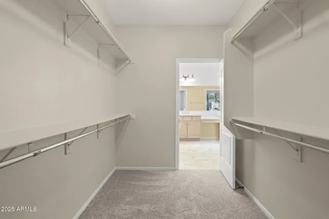 a bathroom with a tub shower and sink
