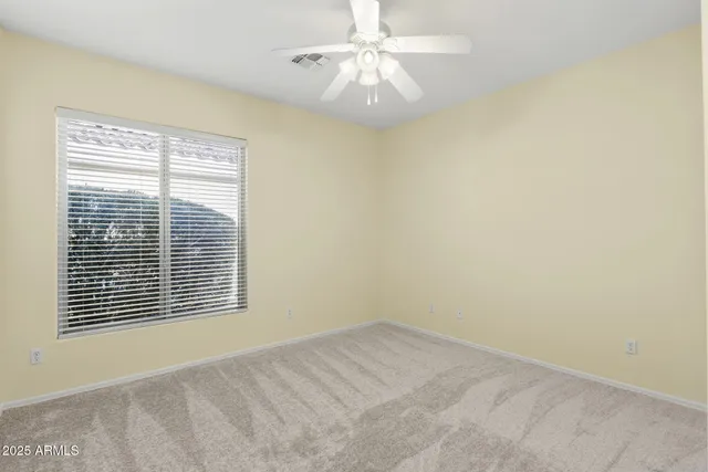 a view of a hallway view with wooden floor and a living room