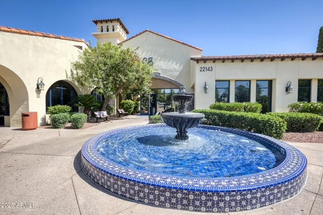 a view of a house with entertaining space and potted plants