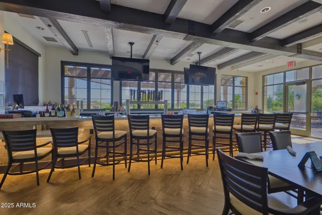 a view of a house with patio and a yard