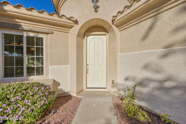 a view of a house with backyard and porch