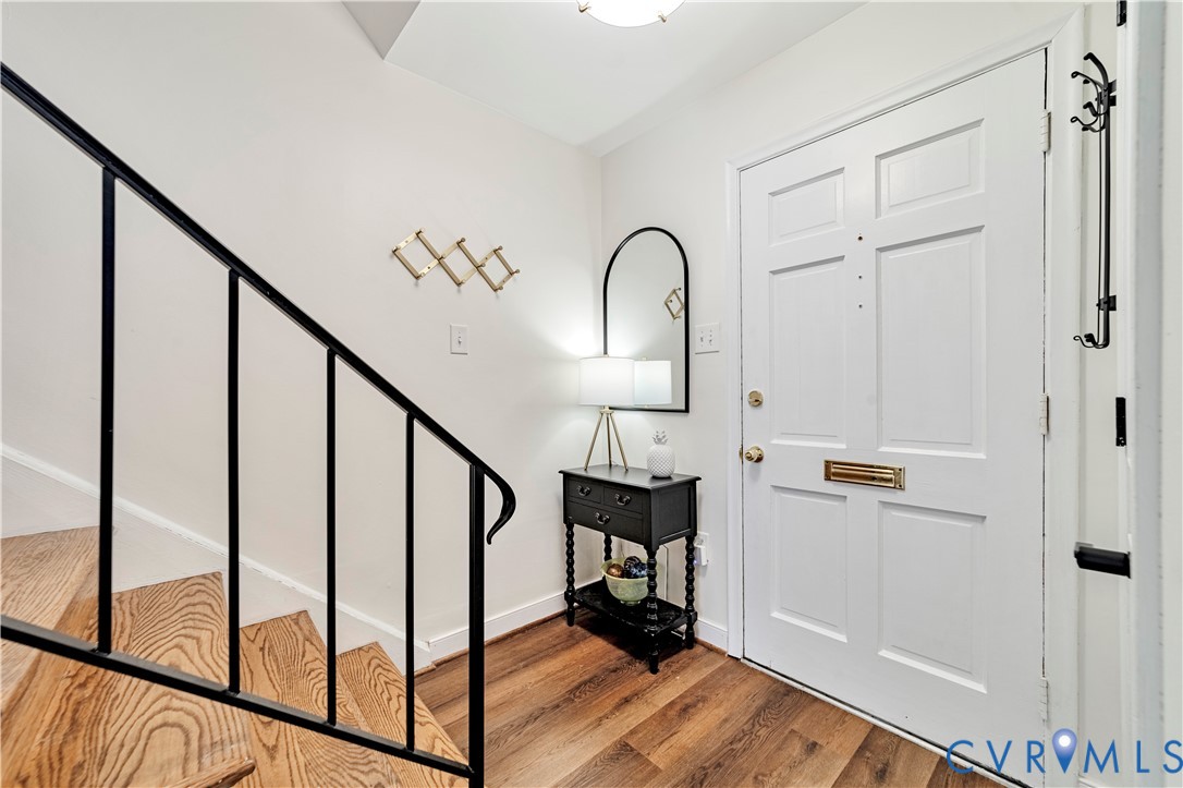 9111 Derbyshire Road, Unit G Henrico, VA 23229 - Photo 11 of 42 a view of a hallway with wooden floor and staircase