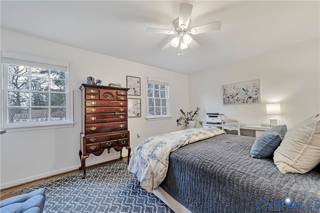 9111 Derbyshire Road, Unit G Henrico, VA 23229 - Photo 18 of 42 a bedroom with a bed and a chandelier