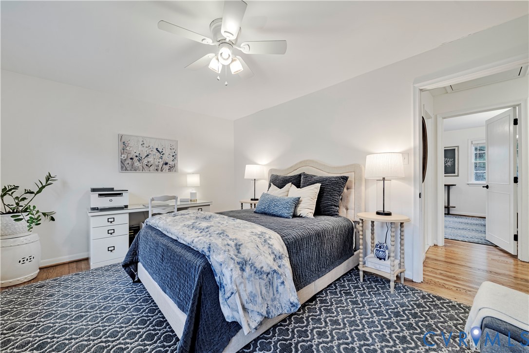 9111 Derbyshire Road, Unit G Henrico, VA 23229 - Photo 19 of 42 a bedroom with a bed and a chandelier