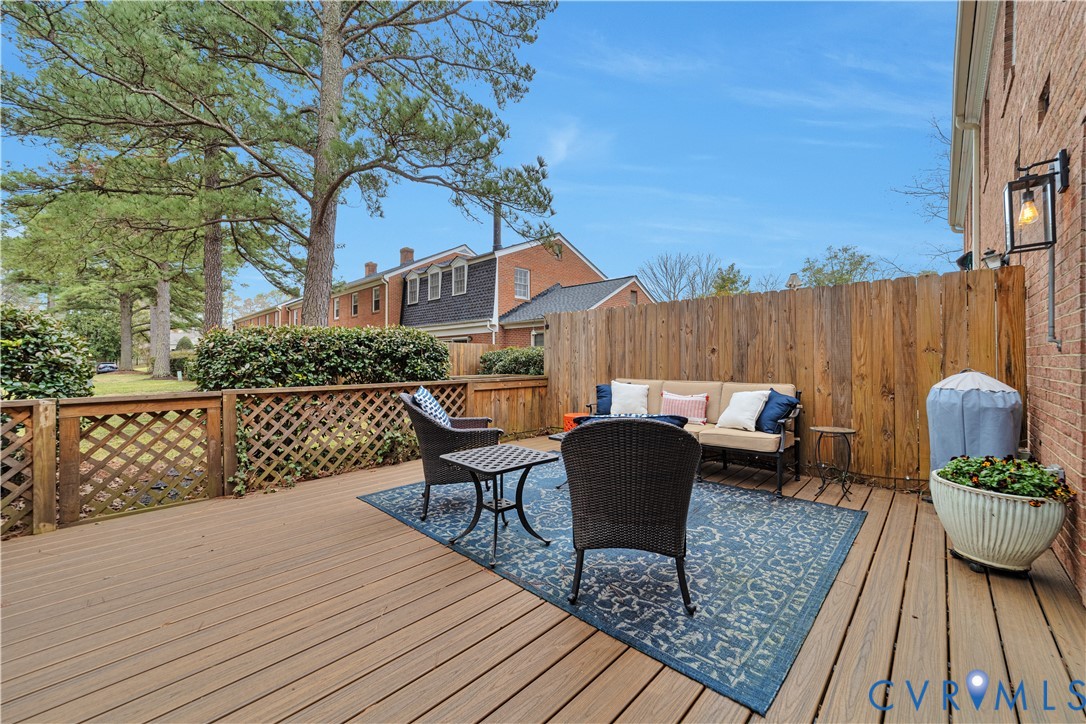 9111 Derbyshire Road, Unit G Henrico, VA 23229 - Photo 24 of 42 a view of a roof deck with table and chairs couches with wooden floor