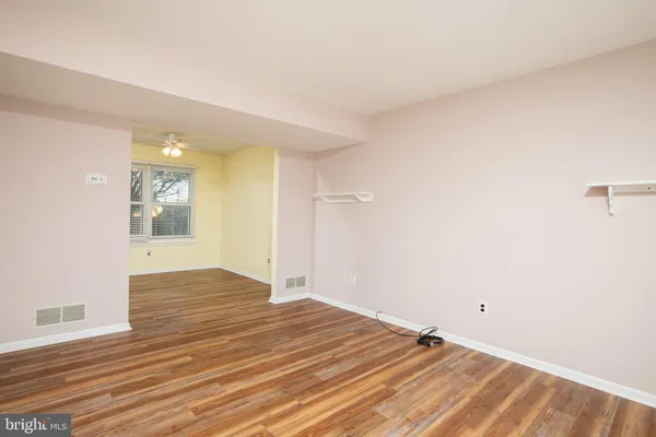 a view of an empty room and window