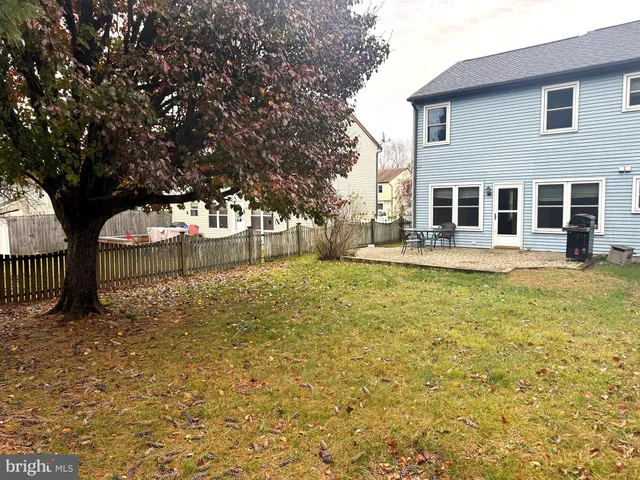 a view of a house with brick walls