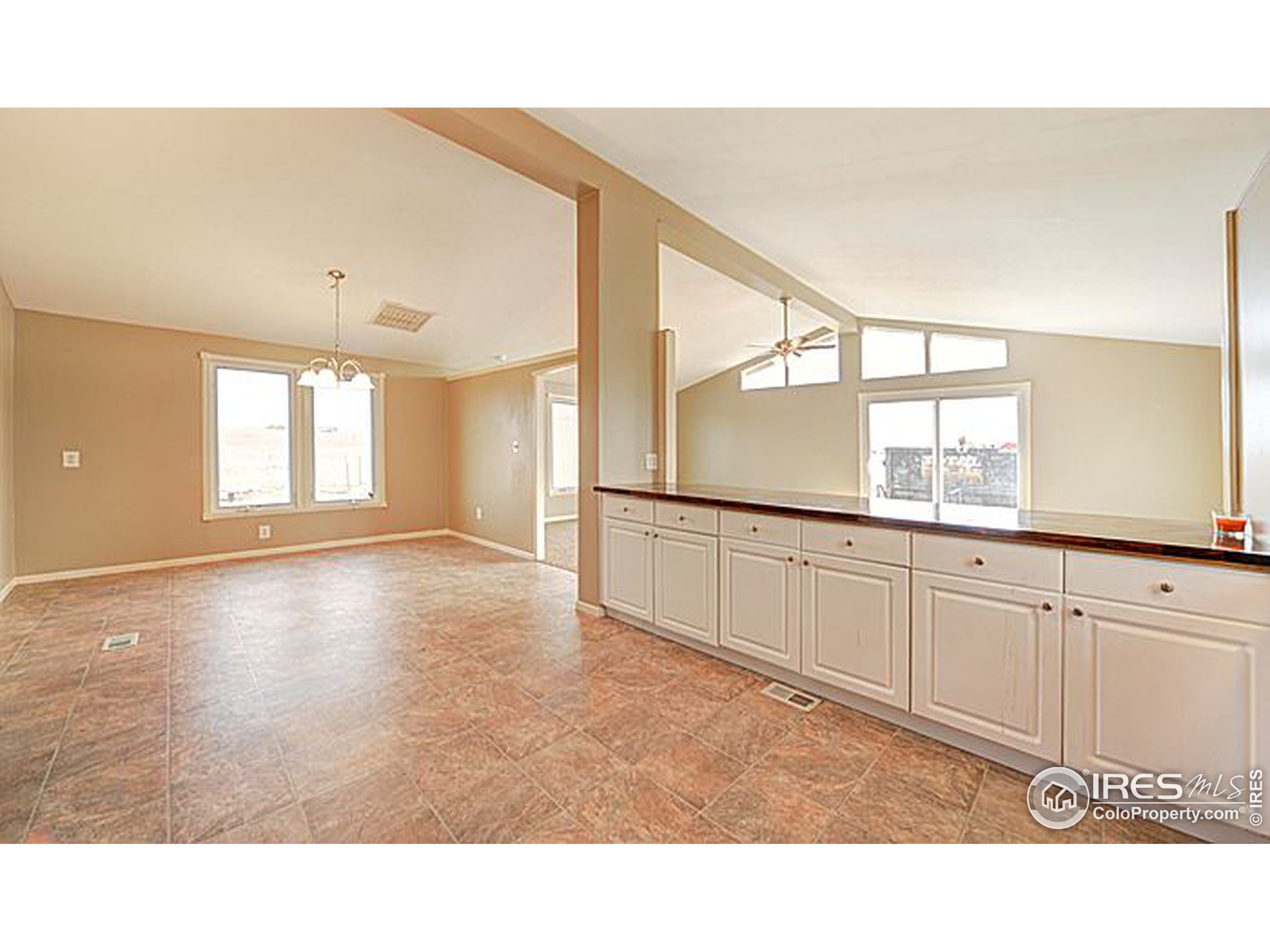 8966 County Road Hudson, CO 80642 - Photo 11 of 25 a open hall with wooden floor and cabinet