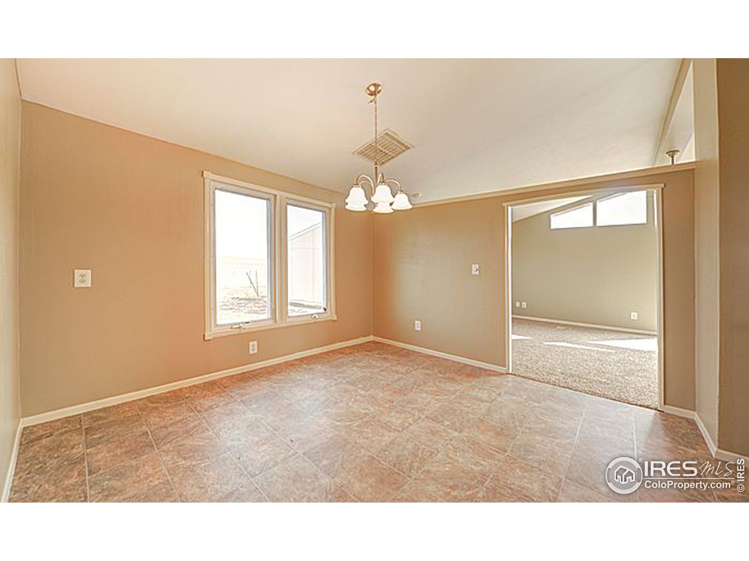 8966 County Road Hudson, CO 80642 - Photo 10 of 25 a room with windows and ceiling fan