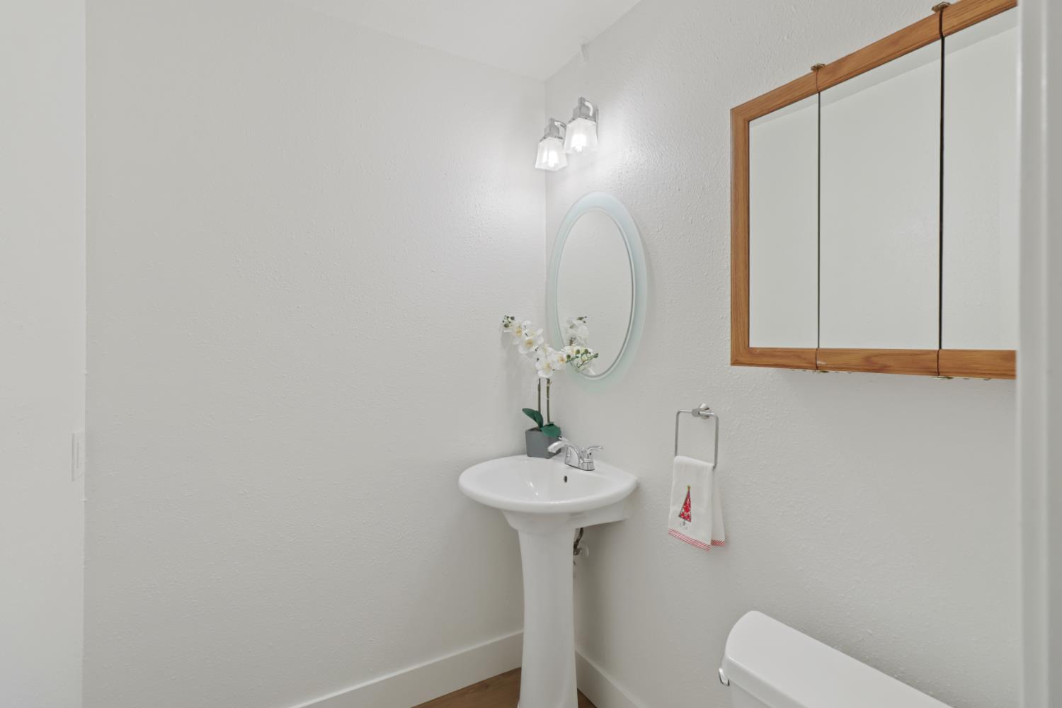 10049 Elgin River Court Rancho Cordova, CA 95670 - Photo 19 of 44 Downstairs half bathroom close to bedroom and garage.