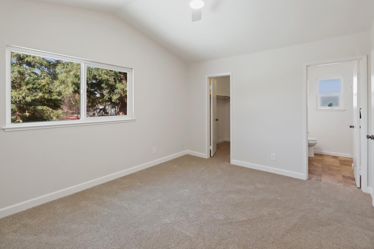 10049 Elgin River Court Rancho Cordova, CA 95670 - Photo 23 of 44 Primary Suite w vaulted ceiling, walk in closet, and full bath.