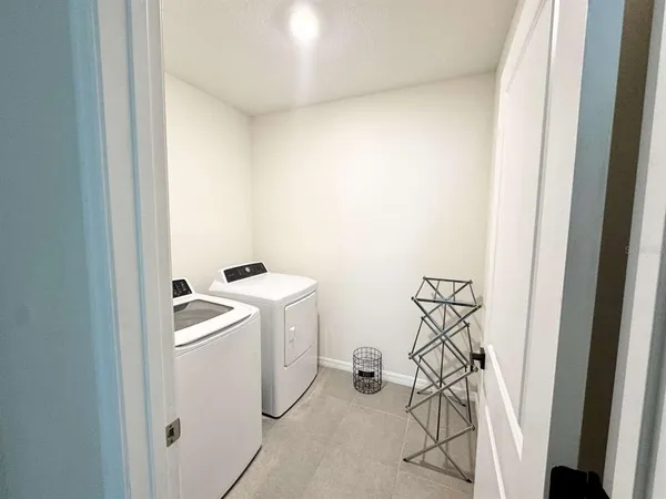 a bedroom with bed and window