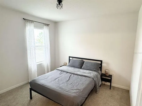 a view of a house with backyard and porch