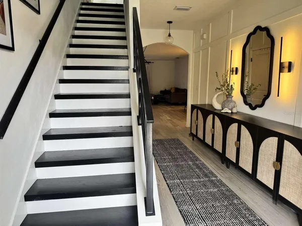 a living room with furniture and a chair