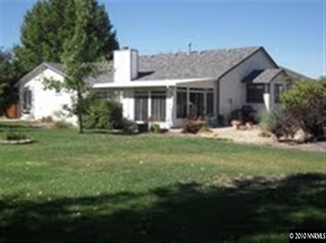 550 Holcomb Ranch Lane Reno, NV 89511 - Photo 7 of 7 a front view of house with yard and green space