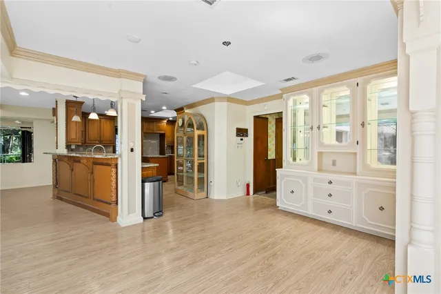a kitchen with stainless steel appliances granite countertop a stove and a refrigerator