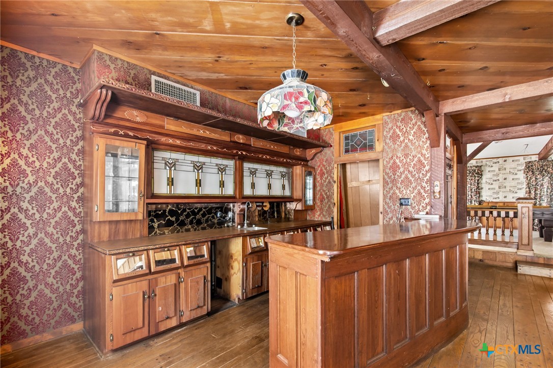 1101 Clark Street Yoakum, TX 77995 - Photo 21 of 48 a kitchen with stainless steel appliances granite countertop a stove and cabinets