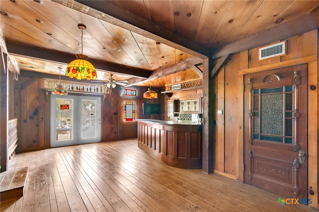 1101 Clark Street Yoakum, TX 77995 - Photo 23 of 48 a view of a hallway with wooden floor