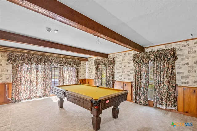 a bathroom with a toilet sink and shower