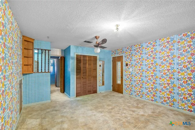 a view of a yard with a house in the background