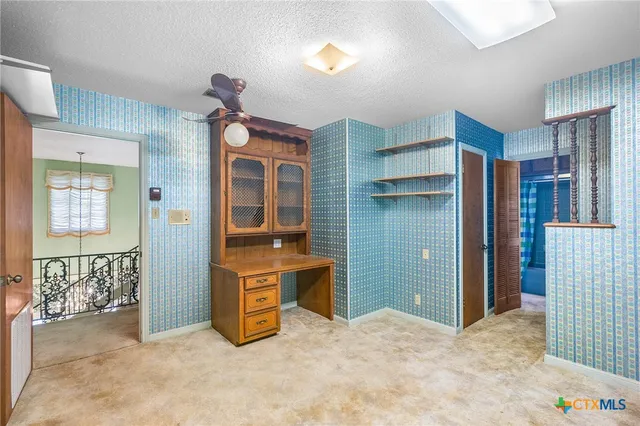 a view of a building with a yard