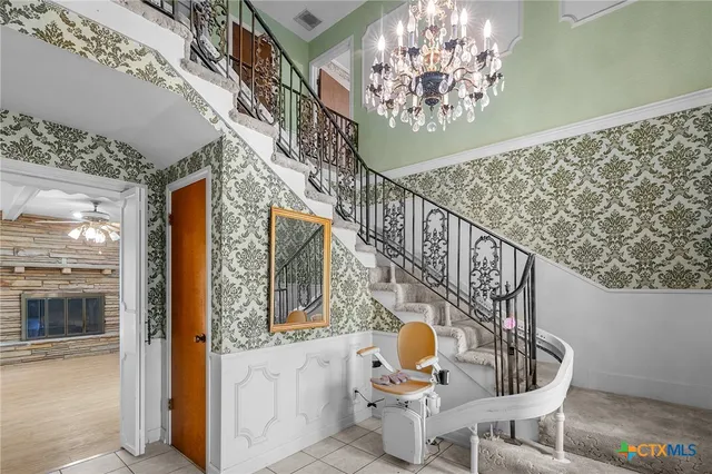 a view of an empty room and a window