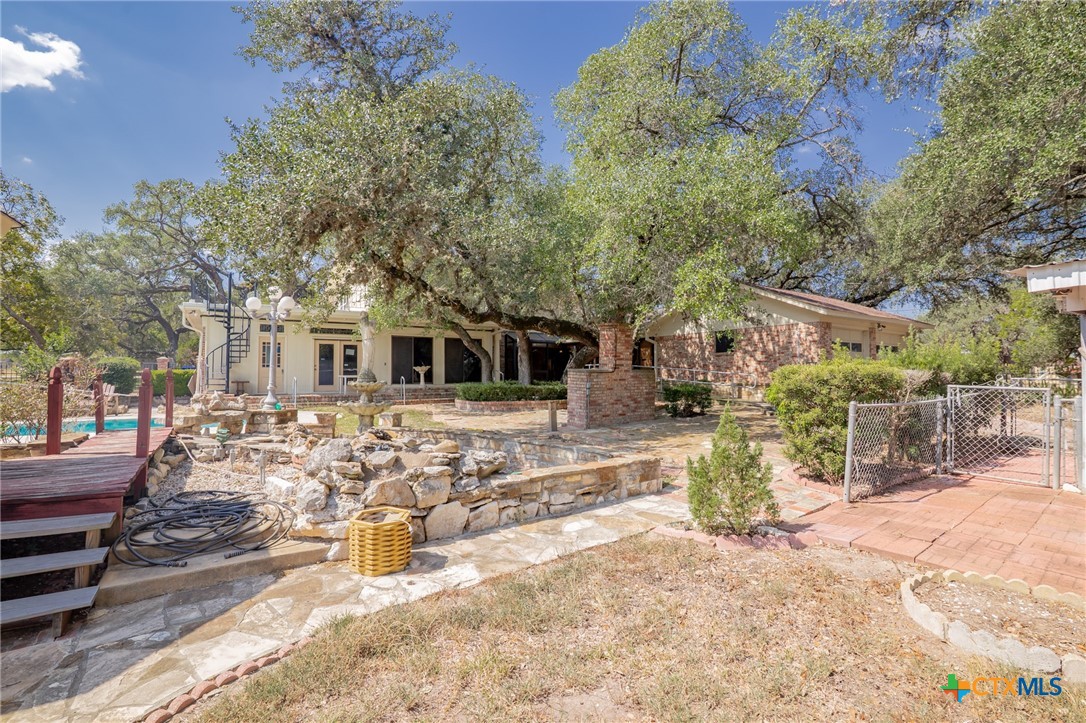 1101 Clark Street Yoakum, TX 77995 - Photo 47 of 48 a view of a yard with a house in the background