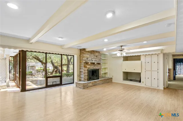 a kitchen with a stove a sink and a refrigerator