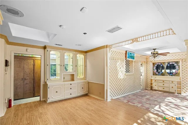 a kitchen with stainless steel appliances granite countertop wooden cabinets a sink and a stove